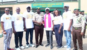Colleagues, friends of the celebrant, and officers of the Nigerian Correctional Service pose for a group photo during the 60th birthday outreach of Paul Harris Ogbole, SAN, at the Kuje Custodial Centre.