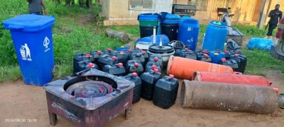NDLEA officers inspecting recovered laboratory equipment; use an official NDLEA image where reuse is permitted.